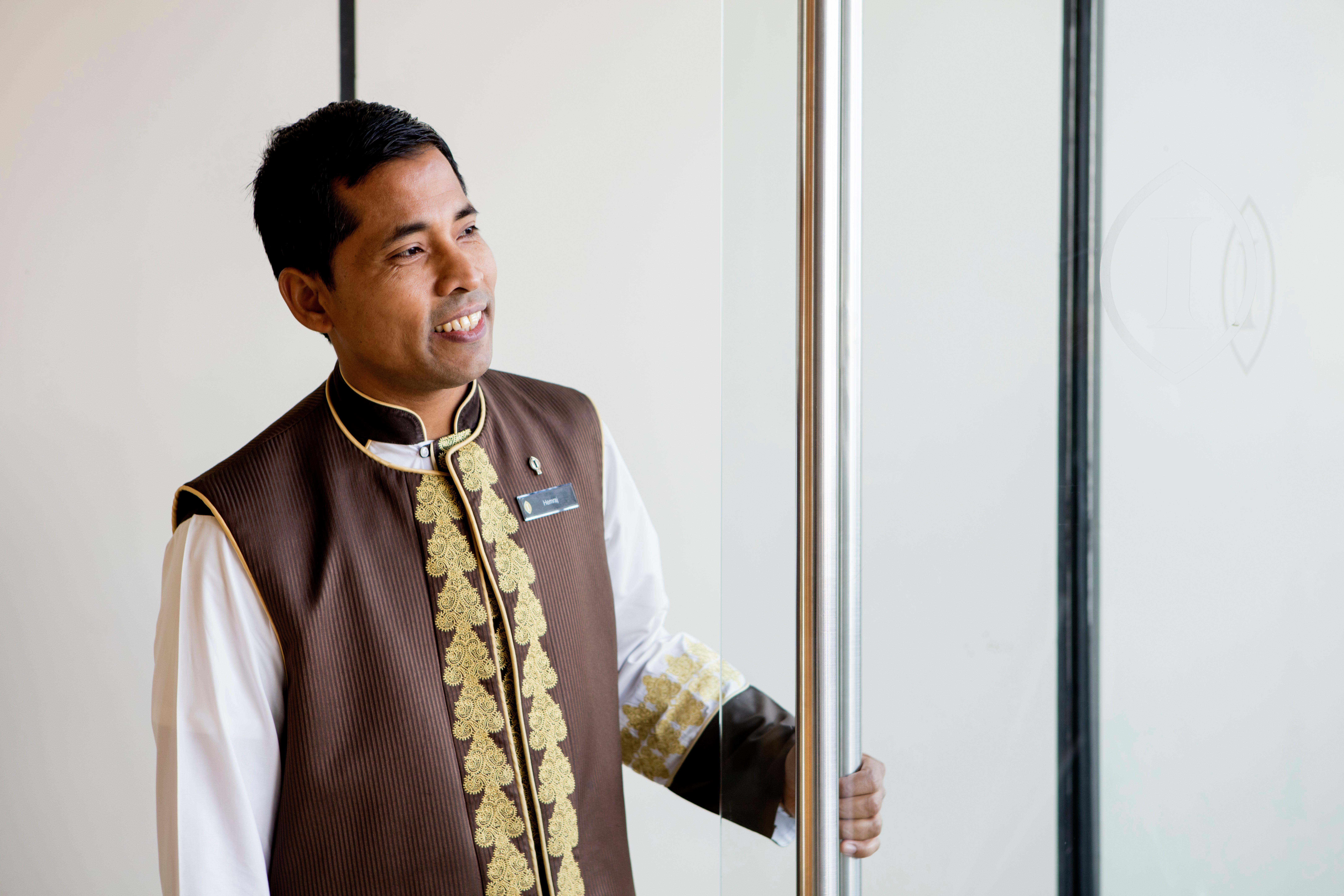 Intercontinental Dubai Festival City By Ihg Екстериор снимка A hotel doorman in Dubai