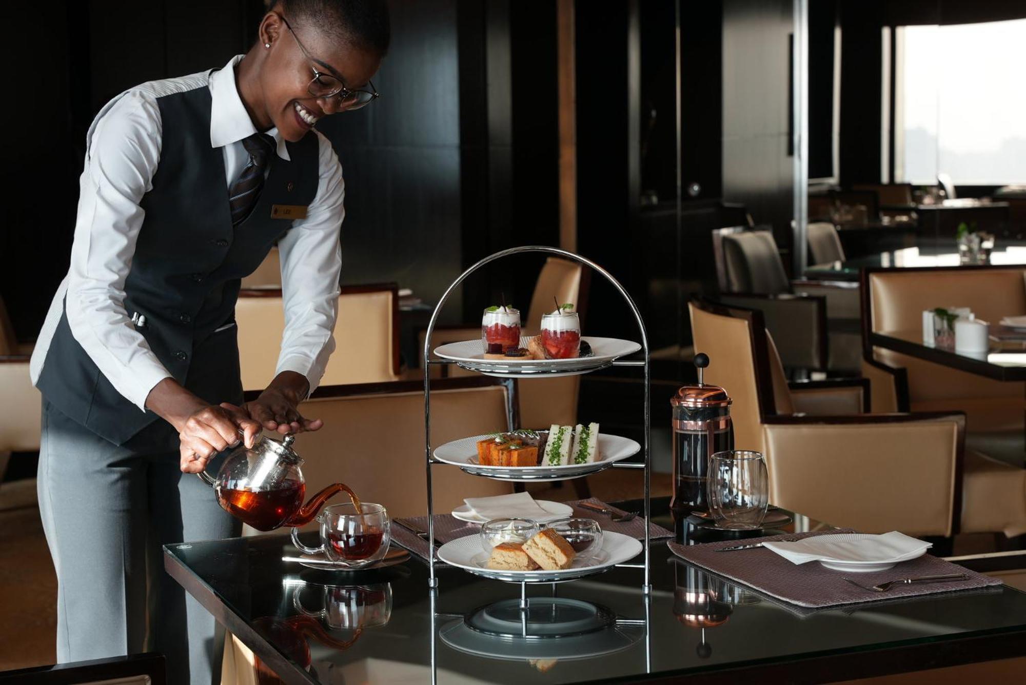 Intercontinental Dubai Festival City By Ihg Екстериор снимка Afternoon tea at the Emirates Lounge in Dubai International Airport
